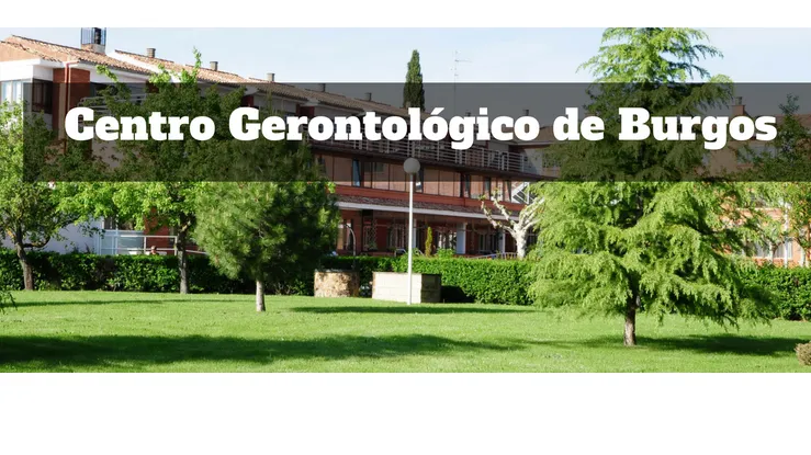 Residencia de mayores centro gerontologico de burgos con césped, árboles y edificio de ladrillo